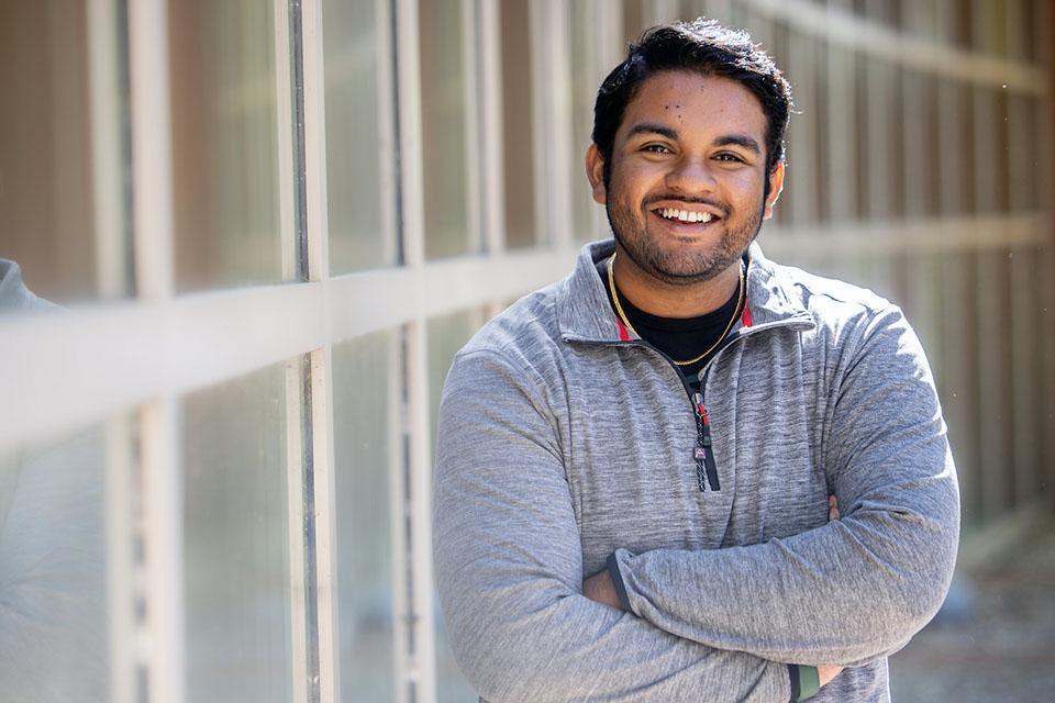 Miit Shah poses for a photo outside on campus.